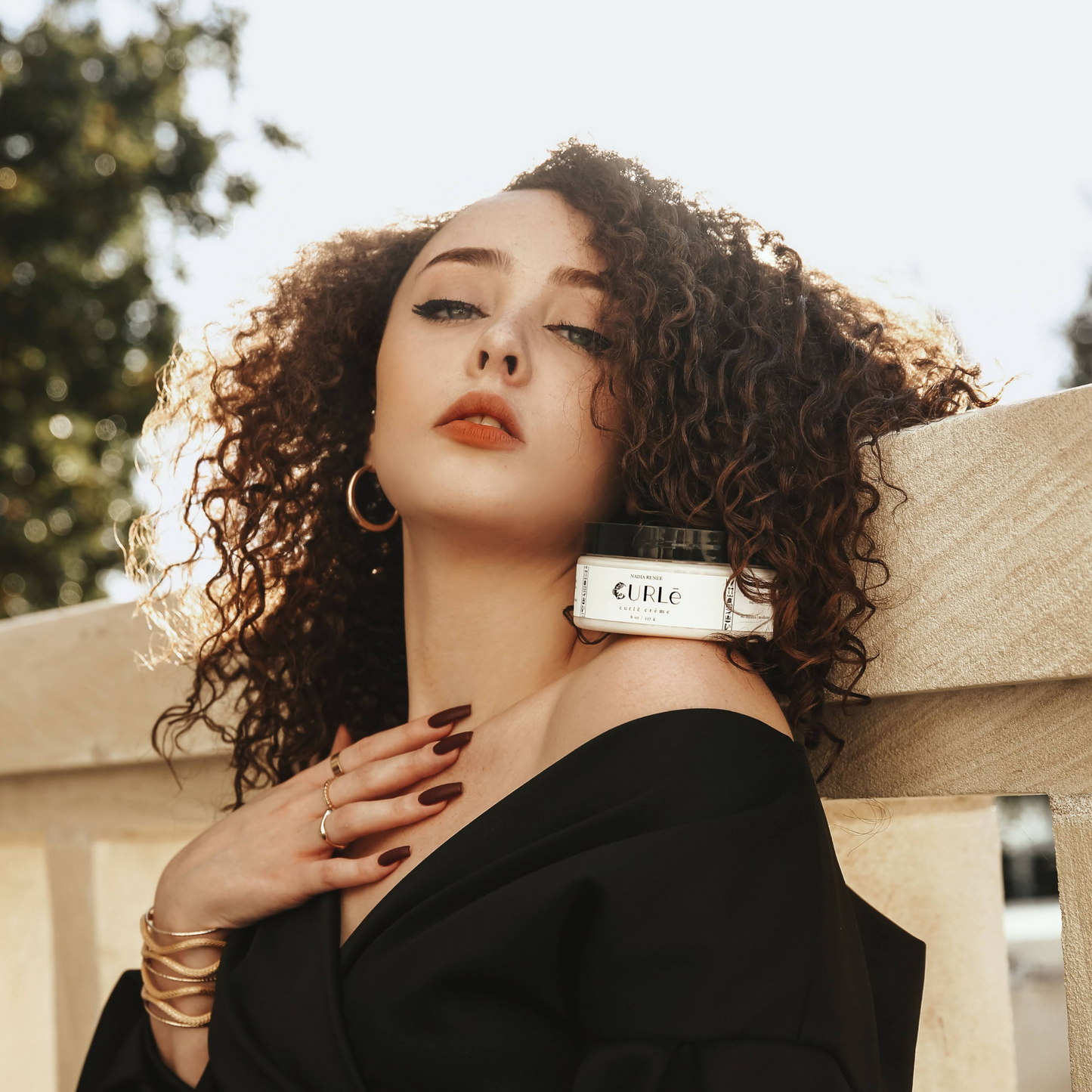 curly haired girl with styling cream